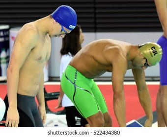 Hong Kong, China - Oct 29, 2016. Mitch LARKIN (AUS) And Omar PINZON (COL) At The Start. FINA Swimming World Cup, Preliminary Heats, Victoria Park Swimming Pool.