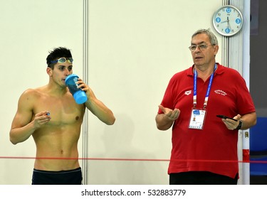 Hong Kong, China - Oct 29, 2016. Gergely GYURTA (HUN) with his coach Ferenc KOVACSHEGYI (HUN) after the Men's Individual Medley 400m Final. FINA Swimming World Cup, Victoria Park Swimming Pool.