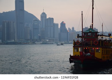 HONG KONG, CHINA, OCTOBER 07 - Colorful boat with the skyline of Hong Kong island on the background seen from Tsim Sha Tsui promenade on october 07, 2018 in Hong Kong