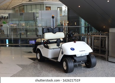 Hong Kong, China - October 7, 2018: White Electric Utility Golf Cart Or Buggy Car For People Transportation At Inside Hong Kong International Airport