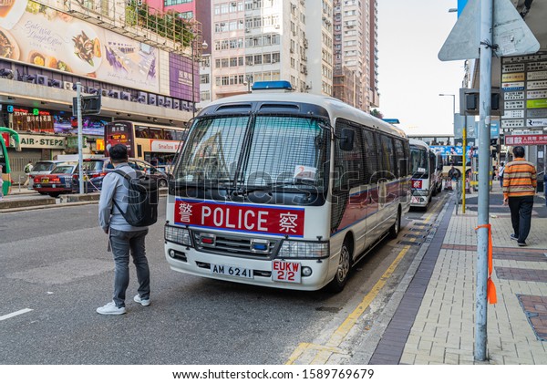 HONG KONG, CHINA - Hong Kong police vehicle on\
duty on Nathan Road in Kowloon, Hong Kong, China. The Mercedes-Benz\
Sprinter van is the most commonly seen police vehicles in Hong\
Kong.November 28,2019.