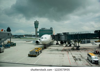 HONG KONG, CHINA - SEPTEMBER 3 : Traffic Road And People Working With Airplane Takeoff And Landing On Runway At Hong Kong Airport Or Chek Lap Kok Airport On September 3, 2018 In Hong Kong, China