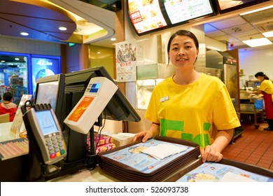 HONG KONG - CIRCA NOVEMBER, 2016: Indoor Portrait Of A Worker At A McDonald's Restaurant In Hong Kong. McDonald's, Or Simply McD, Is An American Hamburger And Fast Food Restaurant Chain.