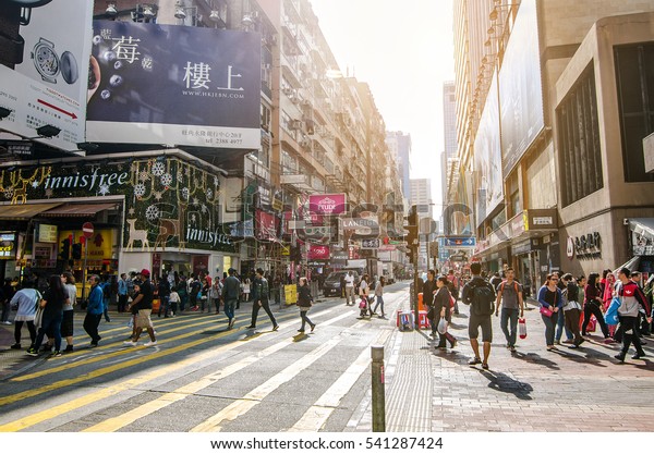 HONG KONG - Dec 11: Mong kok at morning on Dec 11,\
2016 in Hong Kong. Mong kok is characterized by a mixture of old\
and new multi-story buildings, with shops and restaurants at street\
level.