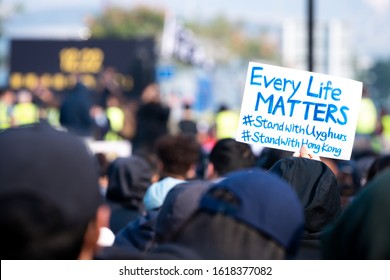 HONG KONG - DECEMBER 22 2019: A Hong Kong Protestor Holds An 'Every Life Matters' Sign In Support Of Uyghur Muslims At The 'Uyghur Solidarity Rally' At Edinburgh Place, Central Hong Kong.