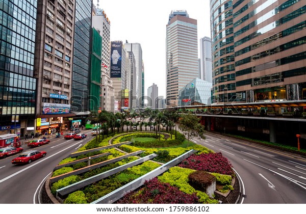 Hong Kong, February 2014: on streets Hong Kong.\
Attractions and business buildings of metropolis. Skyscrapers and\
Park areas. Urban landscape Asian city. Life in Hong Kong.\
Architecture in urban city