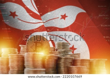 Hong kong flag and big amount of golden bitcoin coins and trading platform chart. Crypto currency concept