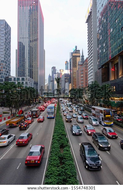 HONG KONG - JAN 2019 : Perspective\
of a busy street in Hong Kong showing buildings and\
traffic