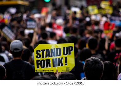 HONG KONG - JULY 1 2019: Hong Kong people holding signage/poster of "Stand Up For HK" to appeal to during a protest against the Extradition Bills on the 22nd Handover Anniversary Day.
