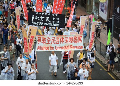 HONG KONG - JULY 1: The  Hong Kong 1 July Protests In Hong Kong On 1 July 2013. The Protesters Request The  Political Reform, The Economic Crisis And The Solution Of Housing Problem