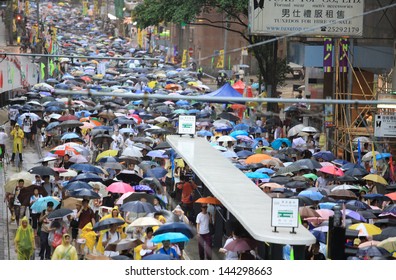 HONG KONG - JULY 1: The  Hong Kong 1 July Protests In Hong Kong On 1 July 2013. The Protesters Request The  Political Reform, The Economic Crisis And The Solution Of Housing Problem