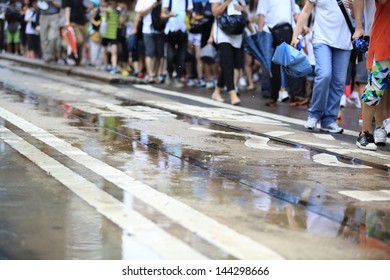 HONG KONG - JULY 1: The  Hong Kong 1 July Protests In Hong Kong On 1 July 2013. The Protesters Request The  Political Reform, The Economic Crisis And The Solution Of Housing Problem