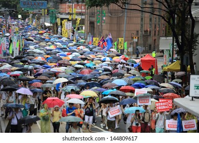 HONG KONG - JULY 1: The Hong Kong 1 July Protests In Hong Kong On 1 July 2013. The Protesters Request The Political Reform, The Economic Crisis And The Solution Of Housing Problem