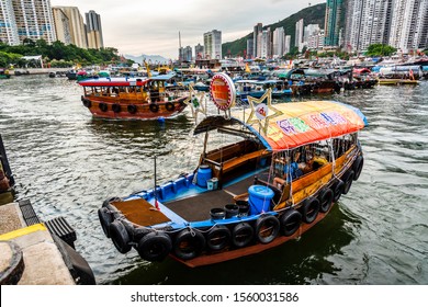 Hong Kong -July 25, 2019: Traditional Fishing Trawler In The Aberdeen Bay. Famous Floating Village In Aberdeen Is An Area And Town On The South Shore Of HongKong Island