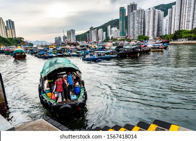 Hong Kong -July 25, 2019: Traditional Fishing Trawler In The Aberdeen Bay. Famous Floating Village In Aberdeen Is An Area And Town On The South Shore Of HongKong Island