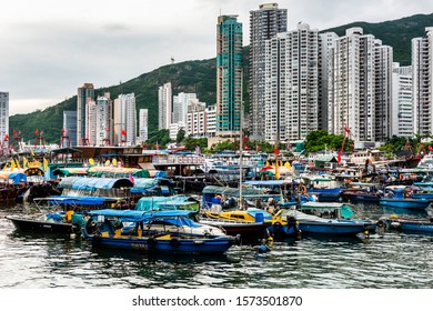 Hong Kong -July 28, 2019: Traditional Fishing Trawler In The Aberdeen Bay. Famous Floating Village In Aberdeen Is An Area And Town On The South Shore Of HongKong Island