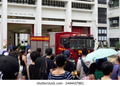 HONG KONG - JULY 7, 2019: Protesters In A March Against The Extradition Bill And Calling For Investigation Of Police Violence Make Way For A Fire Trunk To Get Out. 