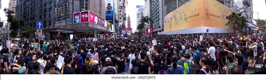 HONG KONG - JULY 7 2019: Hong Kong Protesters marching along the famous tourist spot Nathan Road against the controversial Extradition Bills that allow govt to send people to mainland China for trial.