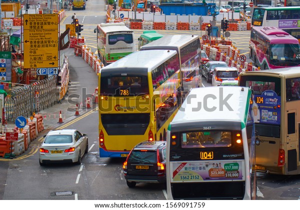 HONG KONG - JULY 9, 2019:
Double decker buses and cars on the road in downtown of famous
Asian city.