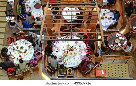 HONG KONG - MARCH 23, 2012 : Chinese Food Restaurant Main Hall With Family Round Tables Top Down View