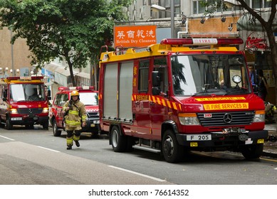 HONG KONG - MAY 02: Firemen And Fire Trucks Arrive In Morning On May 02, 2011 In Chai Wan, Hong Kong, China. A 19-year-old Woman Died And Three People Were Injured In The Fire.