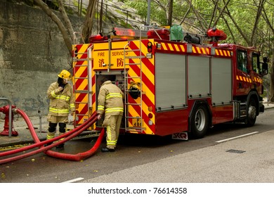 HONG KONG - MAY 02: Firemen And Fire Trucks Arrive In Morning On May 02, 2011 In Chai Wan, Hong Kong, China. A 19-year-old Woman Died And Three People Were Injured In The Fire.