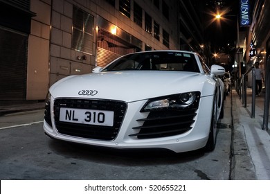 Hong Kong - May 1, 2014: an white Audi R8 supercar parked in the alley at night. This is the first generation Coupé 4.2 FSI quattro (2007–2012), also the first modern super car from Audi.