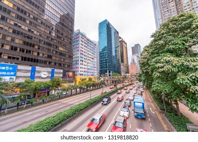 HONG KONG - MAY 10, 2014: City Traffic With Cars And Taxis. Hong Kong Hosts 10 Million Tourists Every Year.