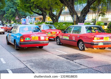 HONG KONG - MAY 10, 2014: City Traffic With Cars And Taxis. Hong Kong Hosts 10 Million Tourists Every Year.