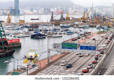 HONG KONG - MAY 10, 2014: City Traffic With Cars And Taxis. Hong Kong Hosts 10 Million Tourists Every Year.