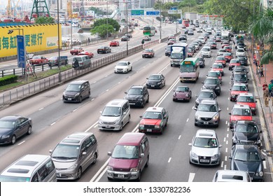 HONG KONG - MAY 10, 2014: City Traffic With Cars And Taxis. Hong Kong Hosts 10 Million Tourists Every Year.