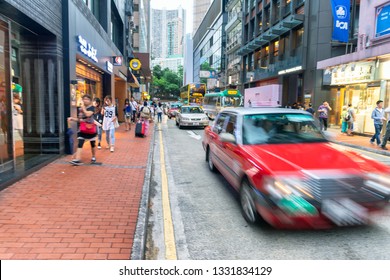 HONG KONG - MAY 10, 2014: City Traffic With Cars And Taxis. Hong Kong Hosts 10 Million Tourists Every Year.