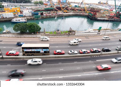 HONG KONG - MAY 10, 2014: City Traffic With Cars And Taxis. Hong Kong Hosts 10 Million Tourists Every Year.