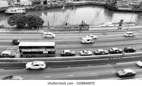 HONG KONG - MAY 10, 2014: City Traffic With Cars And Taxis. Hong Kong Hosts 10 Million Tourists Every Year.