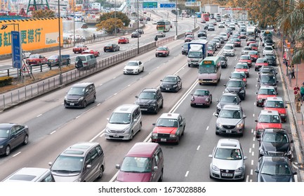 HONG KONG - MAY 10, 2014: City Traffic With Cars And Taxis. Hong Kong Hosts 10 Million Tourists Every Year.