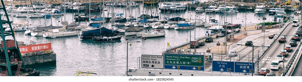 HONG KONG - MAY 10, 2014: City Traffic With Cars And Taxis. Hong Kong Hosts 10 Million Tourists Every Year.