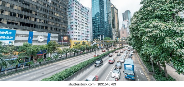 HONG KONG - MAY 10, 2014: City Traffic With Cars And Taxis. Hong Kong Hosts 10 Million Tourists Every Year.