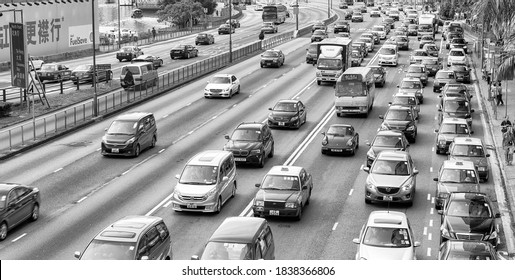 HONG KONG - MAY 10, 2014: City Traffic With Cars And Taxis. Hong Kong Hosts 10 Million Tourists Every Year.