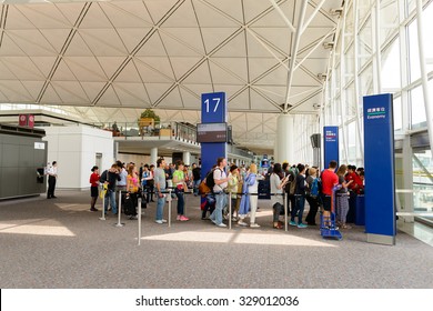 HONG KONG - MAY 13, 2014: People Boarding On The Flight In Hong Kong Airport. Hong Kong International Airport Is The Main Airport In Hong Kong.