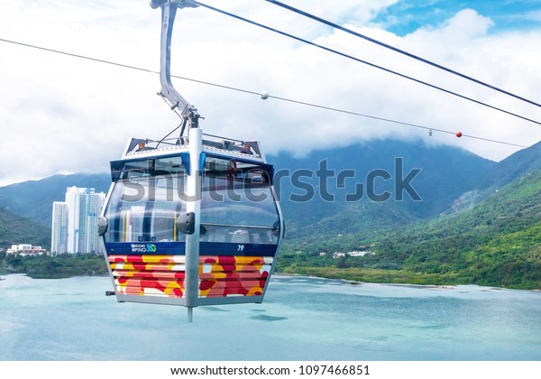 HONG KONG - MAY 5: Ngong Ping Cable Car\
on Lantau island of Hong Kong. Long distance cable car across the\
mountain in Hong Kong, Ngong Ping cable\
car.\
