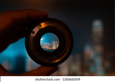 Hong Kong Night View Through Camera Lens. Photography And Travel Concept.