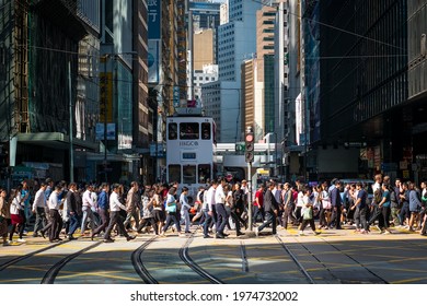 Hong Kong - November, 2019: People crossing street in business district in Central Hong Kong