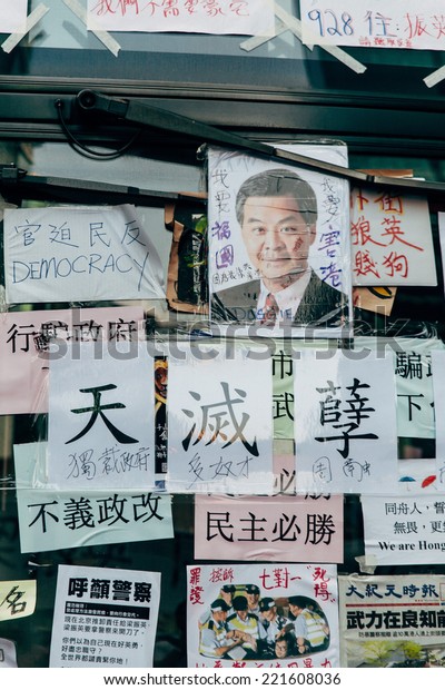 HONG KONG, OCT 1:\
Umbrella Revolution in Mongkok on 1 October 2014. There are many\
slogans and banners sticking on the bus to display for the public\
about this movement.