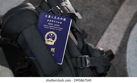 Hong Kong Passport On A Black Suitcase Travel Bag