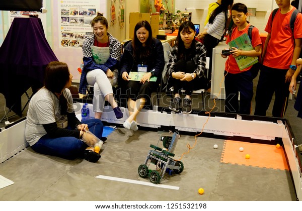 Hong Kong Science Park, Pak Shek Kok, New\
Territories, Hong Kong - 10 November 2018: Students testing and\
doing research on robot\
tank.