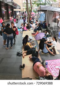 HONG KONG - SEPT 17, 2017: Lots of female workers from Indonesia and the Philippines gather in Central District. Law dictates they must be given twelve consecutive hours of free time each Sunday.