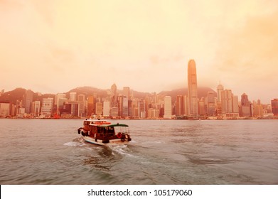 Hong Kong Skyline In The Morning Over Victoria Harbour In Red Tone.