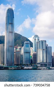 Hong Kong Skyline, Skyscraper Building Cityscape At Victoria Harbor In Sunrise Morning