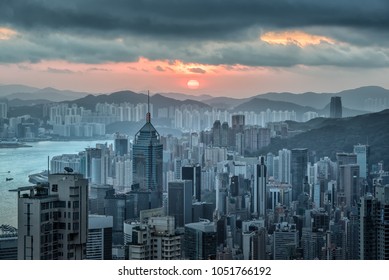 Hong Kong Skyline View From Victoria Peak At Sunrise In The Morning.