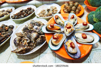 Hong Kong Street Seafood. Shells, Snails, Oysters, Shrimp, Crab At Night Market.